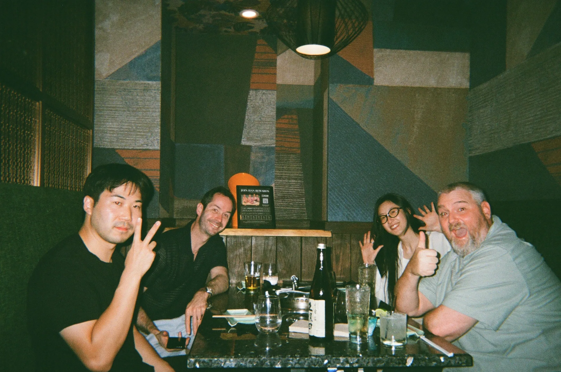 Teammates posing at a restaurant