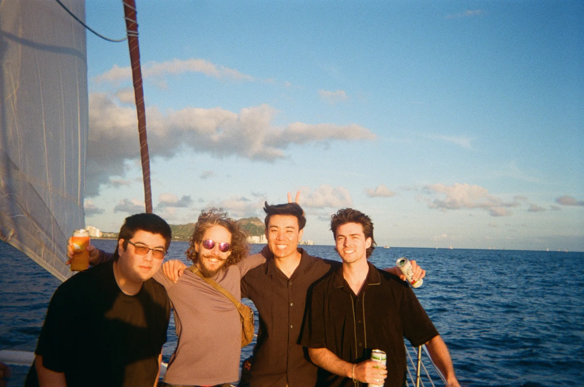Team sailing at golden hour