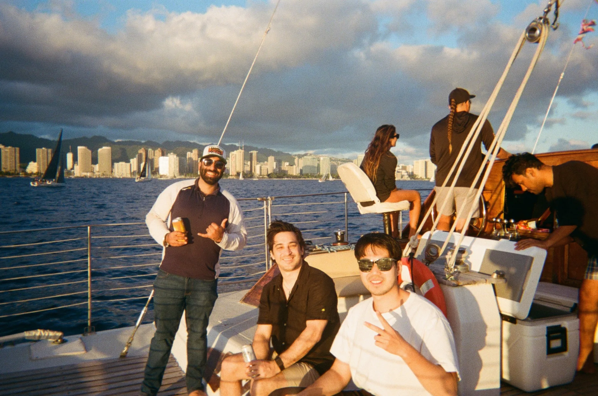 Team on a sailboat at sunset
