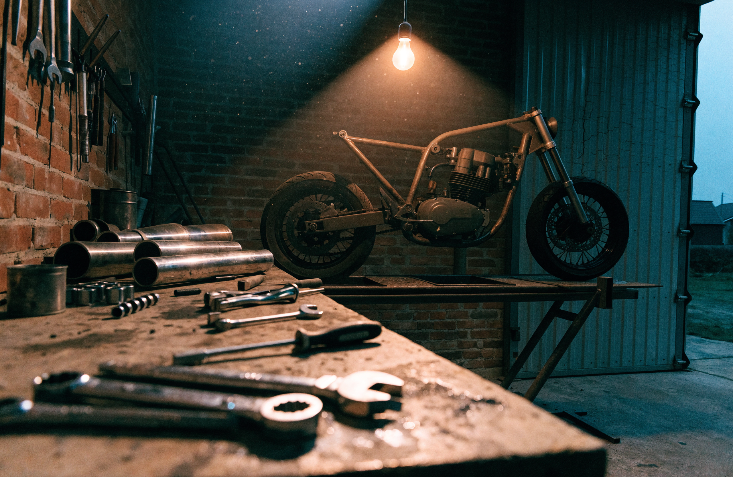 Recraft V4.1 Utility Pro Text-to-Image: Motorcycle workshop under one bulb